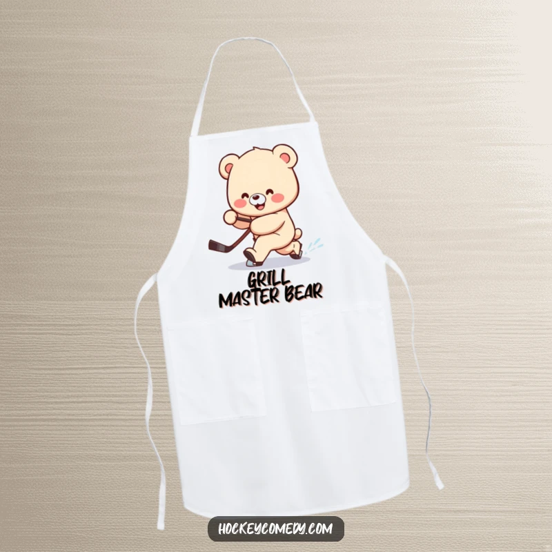 Funny apron showing a smiling bear attempting a clumsy hockey deke, stick trailing behind, ready to cook.