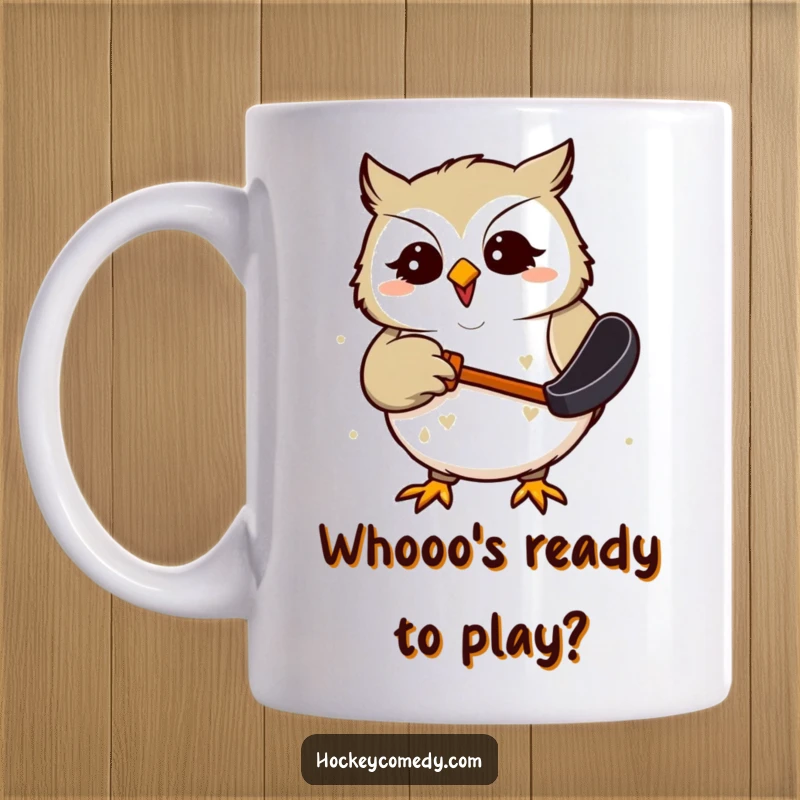 Funny Mug featuring a giggling owl with wide eyes, humorously trying to catch a hockey puck with its beak.
