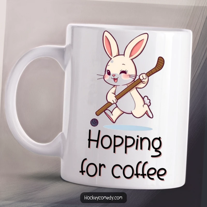 Funny mug featuring a playful rabbit hopping with a hockey stick, ready to hit the ice with sporting enthusiasm.