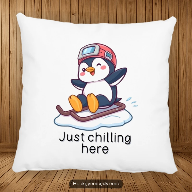 Funny pillow with a playful penguin sliding across ice using a hockey helmet, perfect for cozying up.