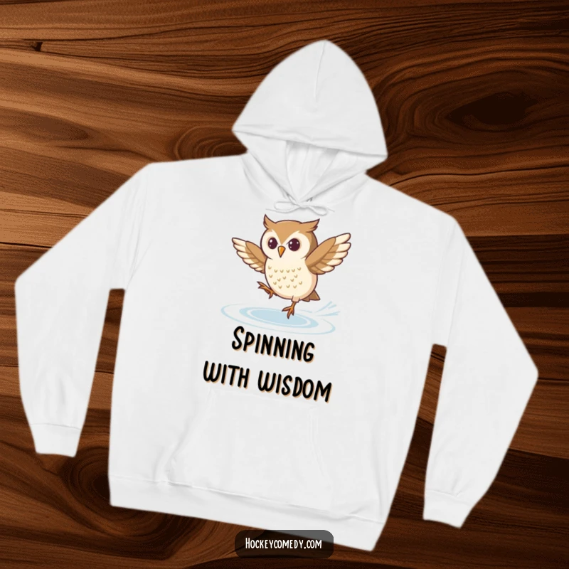 Funny hoodie featuring a determined owl attempting a tricky spin on ice skates, ideal for skaters and humor lovers.