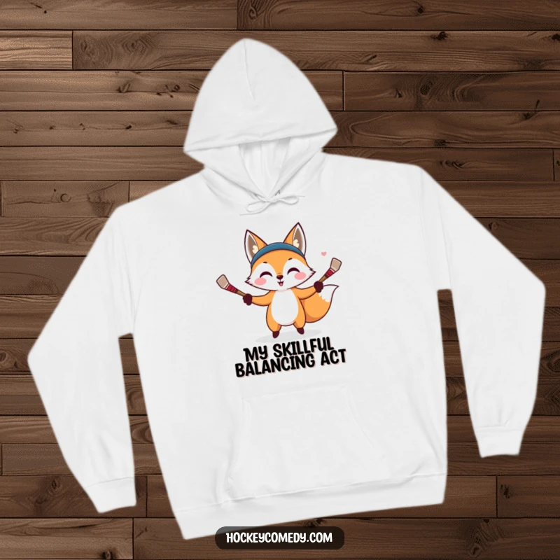 Funny hoodie featuring a cunning fox juggling miniature hockey sticks with impressive skill and a sly expression.