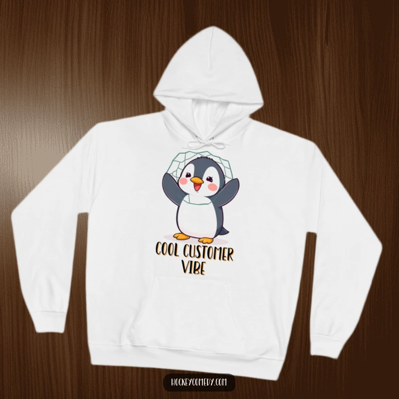 Funny hoodie featuring a delighted penguin enthusiastically flapping while guarding a hockey net with all its might.