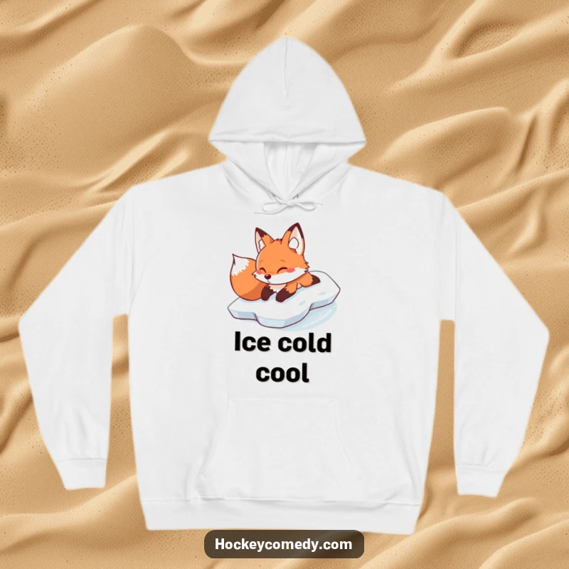 Funny determined fox sliding on its belly across ice, printed on a soft and humorous winter hoodie.