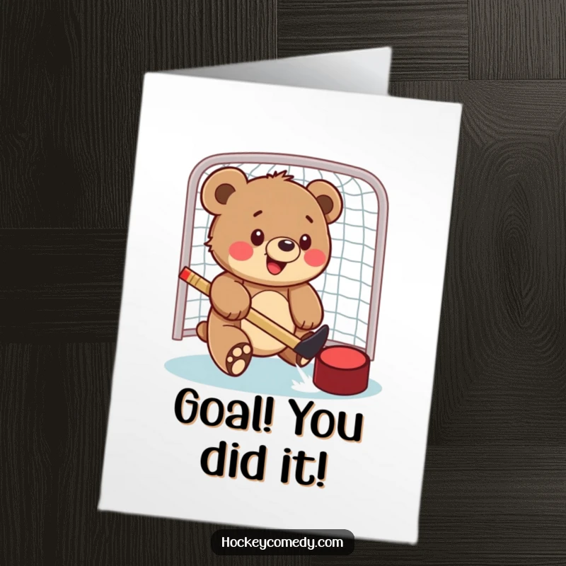 Funny Free Printable Congrats Card: Bear cub scoring a hockey puck into the net, a moment of pure victory.