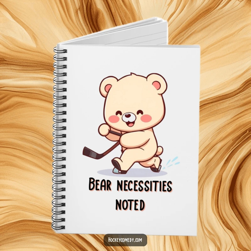 Funny notebook featuring a smiling bear attempting a clumsy hockey deke, stick trailing behind, ready for notes.