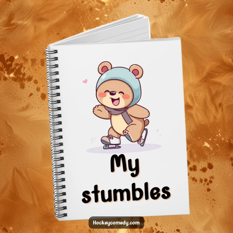 Funny bear giggling as it trips over skates, on the cover of a hilarious and clumsy notebook.