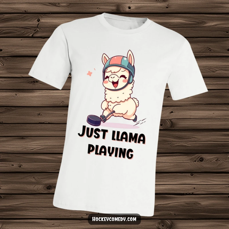 Funny llama t-shirt, giggling, wearing a helmet, joyfully chasing a hockey puck, ideal for sports fans and as a humorous gift.