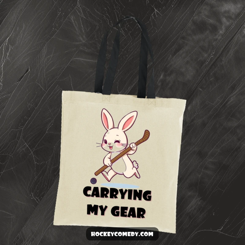 Funny tote bag featuring a rabbit hopping with a hockey stick, ready for game day or carrying essentials with style.