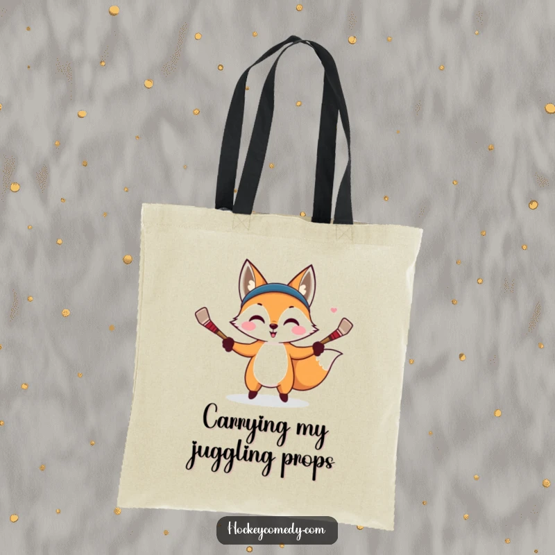 Funny tote bag featuring a mischievous fox juggling tiny hockey sticks, ready to add a sly touch to any outing.