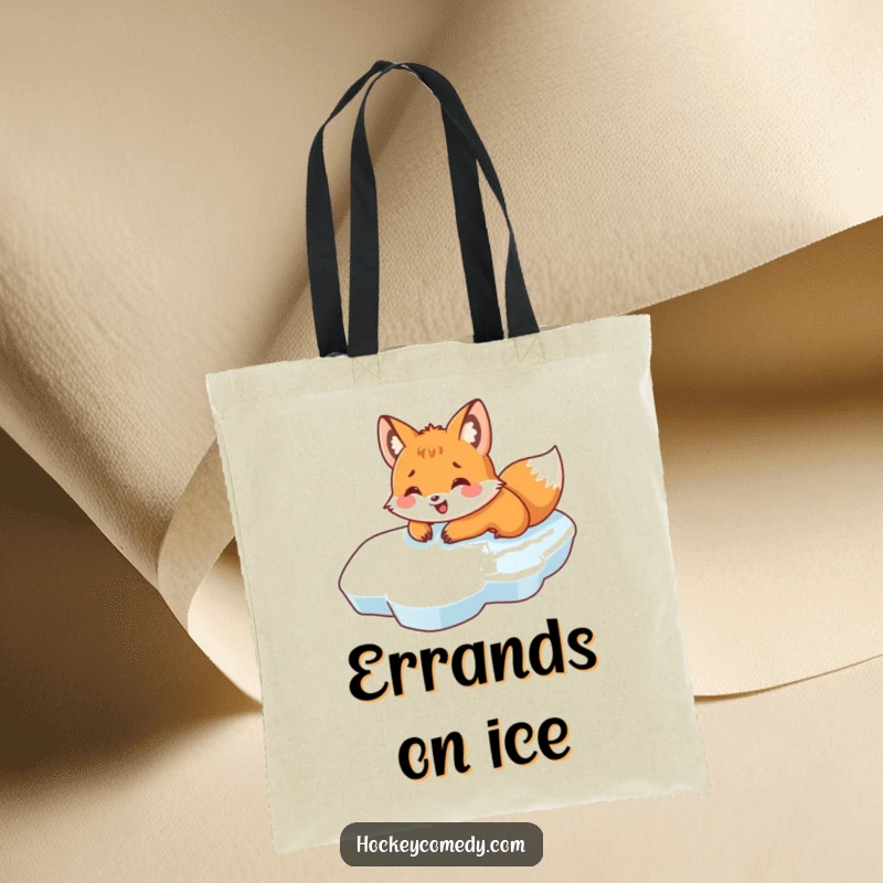 Funny tote bag showcasing a fox joyfully sliding on its belly across ice, perfect for carrying winter essentials with humor.