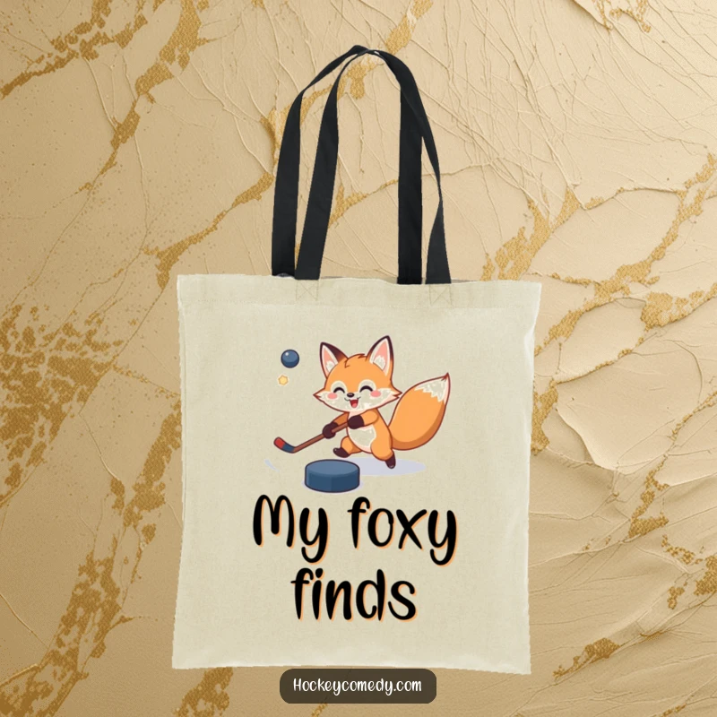 Funny tote bag with a cheerful fox attempting a slap shot, the puck comically missing its mark, perfect for carrying essentials with humor.