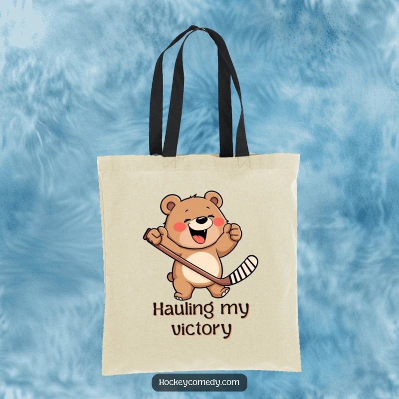 Funny tote bag displaying a happy, roaring bear wildly swinging a hockey stick, ready for adventure and carrying essentials.