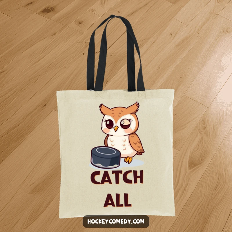 Funny owl attempting to catch a hockey puck with its beak, illustrated on a stylish tote bag.
